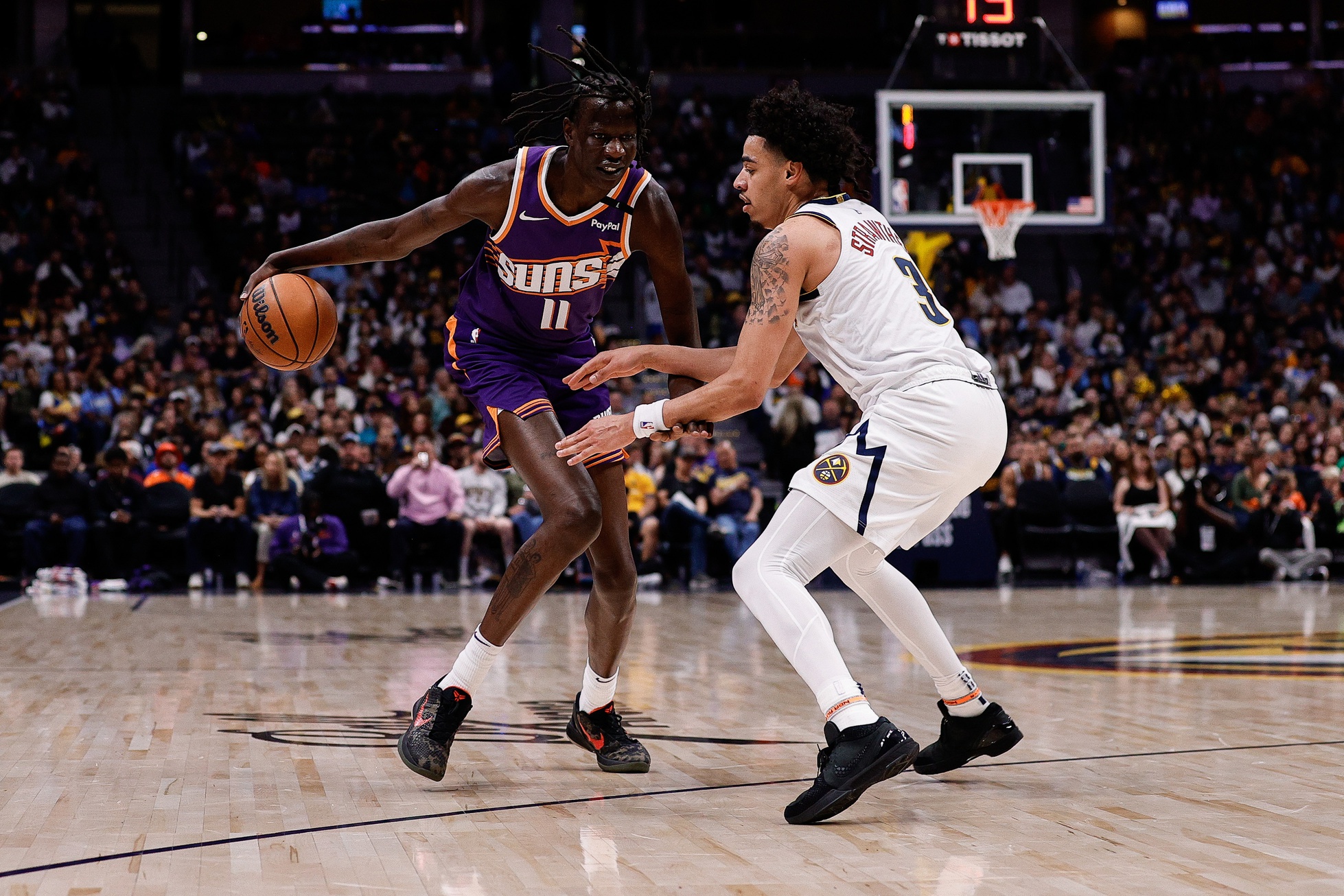 Phoenix Suns center Bol Bol (11) controls the ball