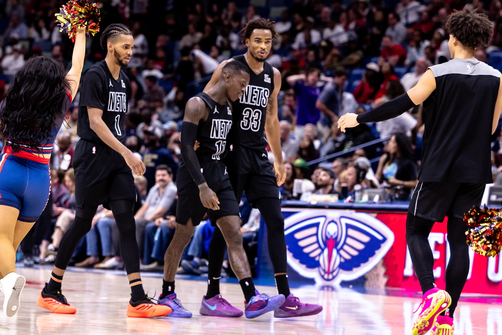 Brooklyn Nets guard Dennis Schroder (17) is congratulated by center Nic Claxton (33) after a play