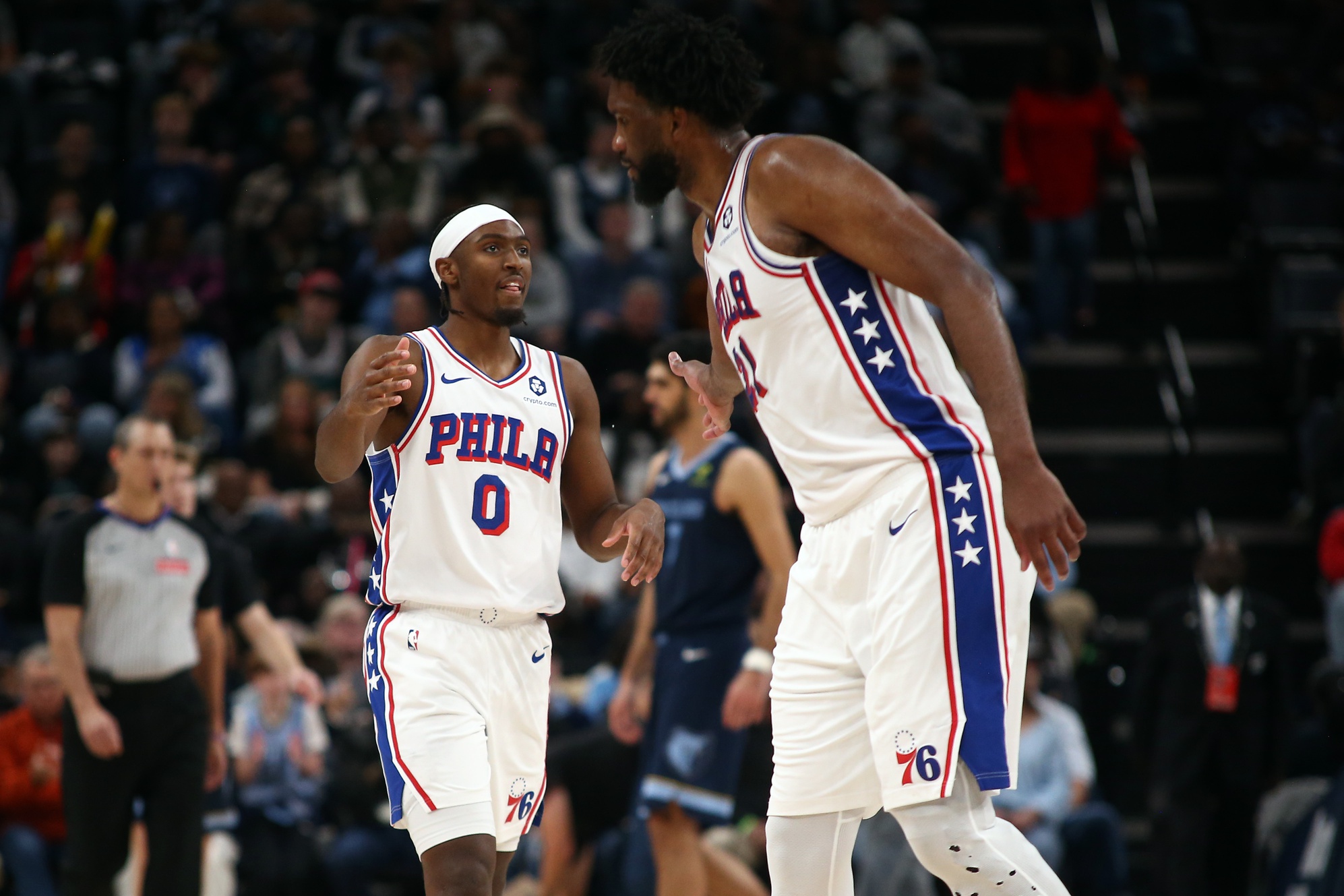 Philadelphia 76ers guard Tyrese Maxey (0) and center Joel Embiid (21)