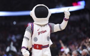 Houston Rockets mascot Dunkstronaut throws shirts to the crowd