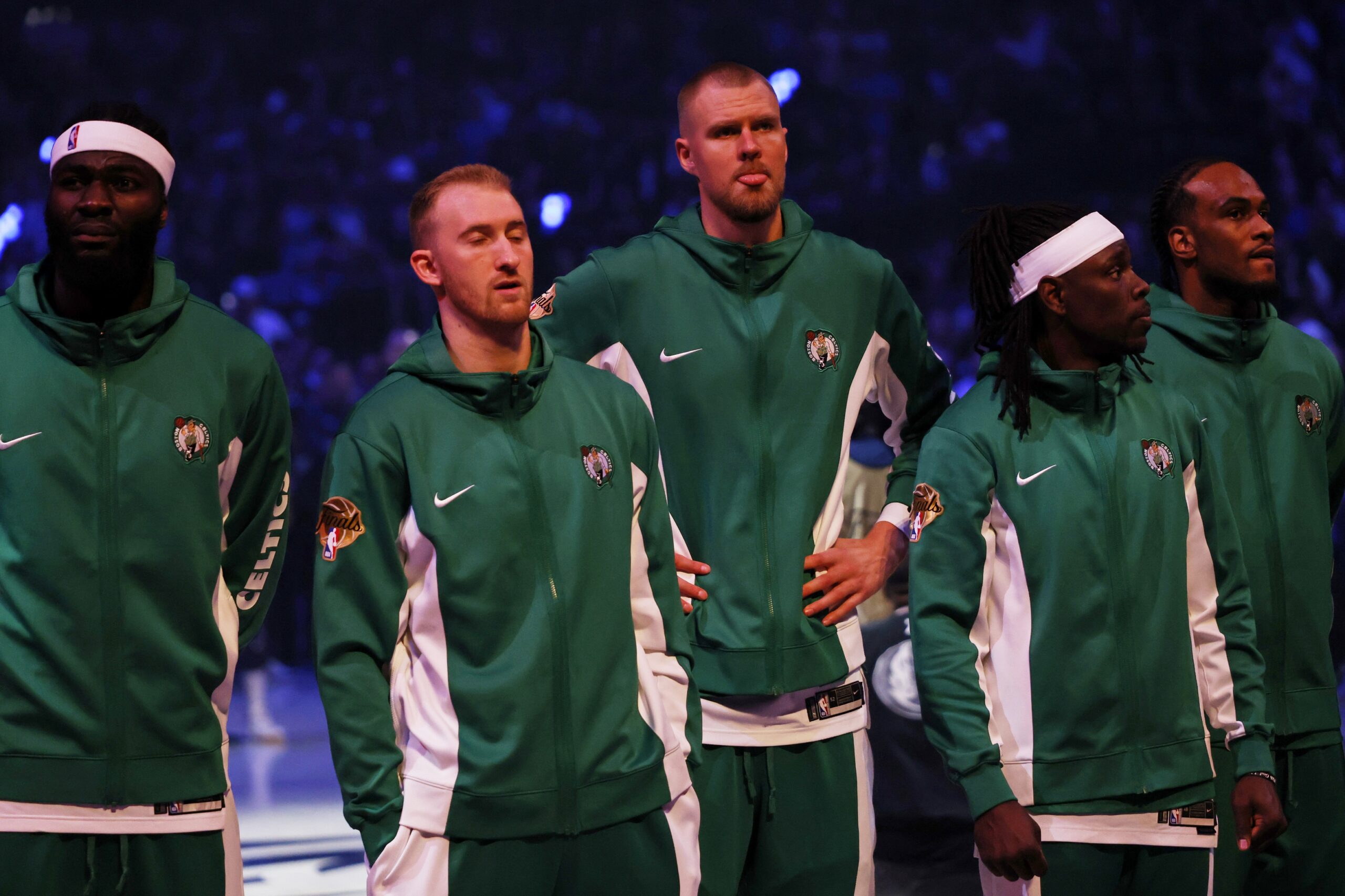 Jun 14, 2024; Dallas, Texas, USA; Boston Celtics center Kristaps Porzingis (back) looks on during the national anthem before game four of the 2024 NBA Finals against the Dallas Mavericks at American Airlines Center. Mandatory Credit: Peter Casey-USA TODAY Sports