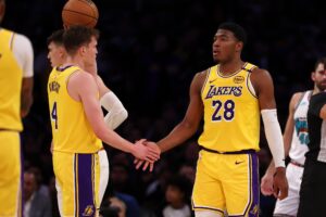 Los Angeles Lakers forward Rui Hachimura is greeted by guard Dalton Knecht