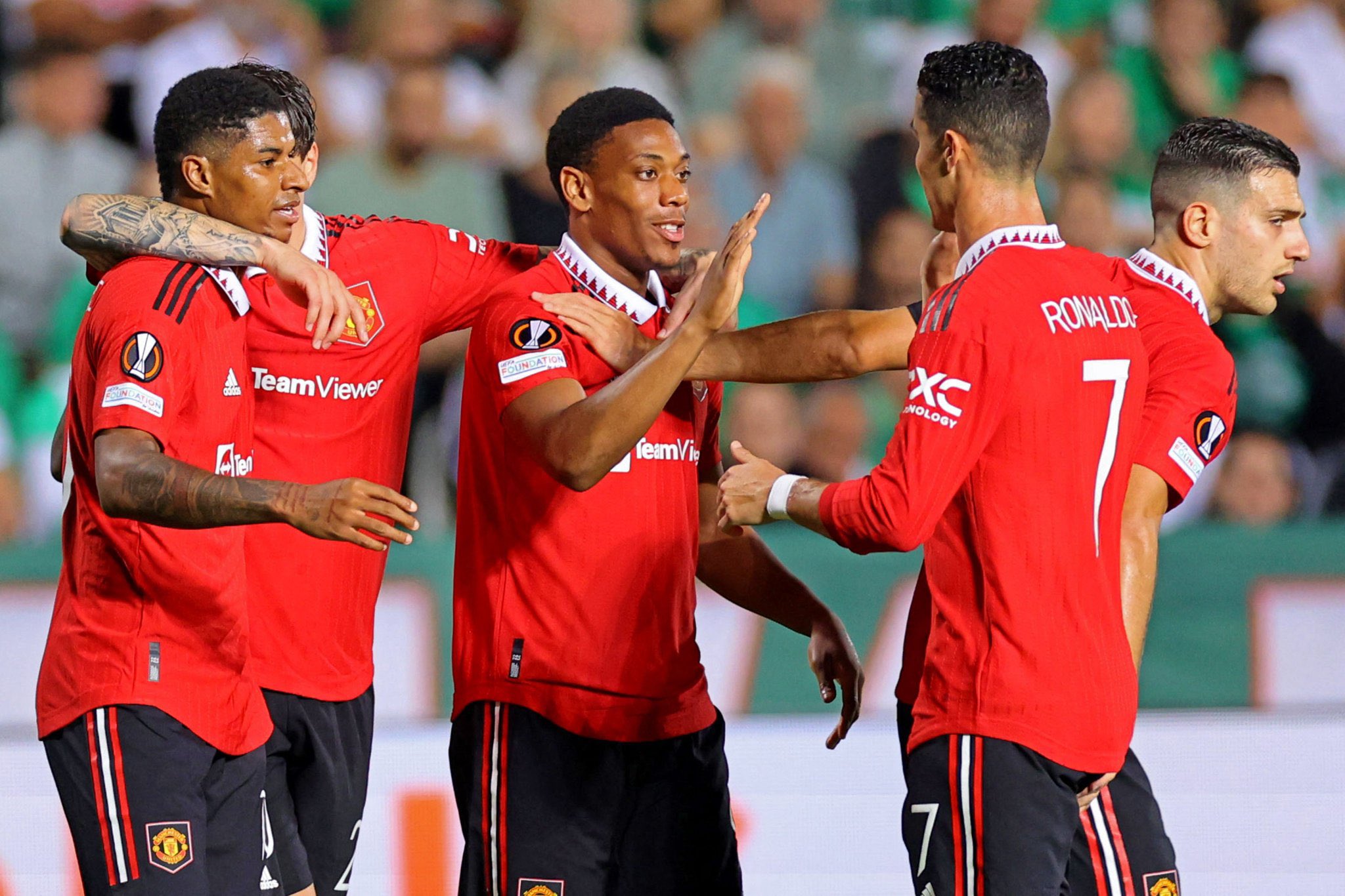 Marcus Rashford celebrates with his Manchester United team-mates