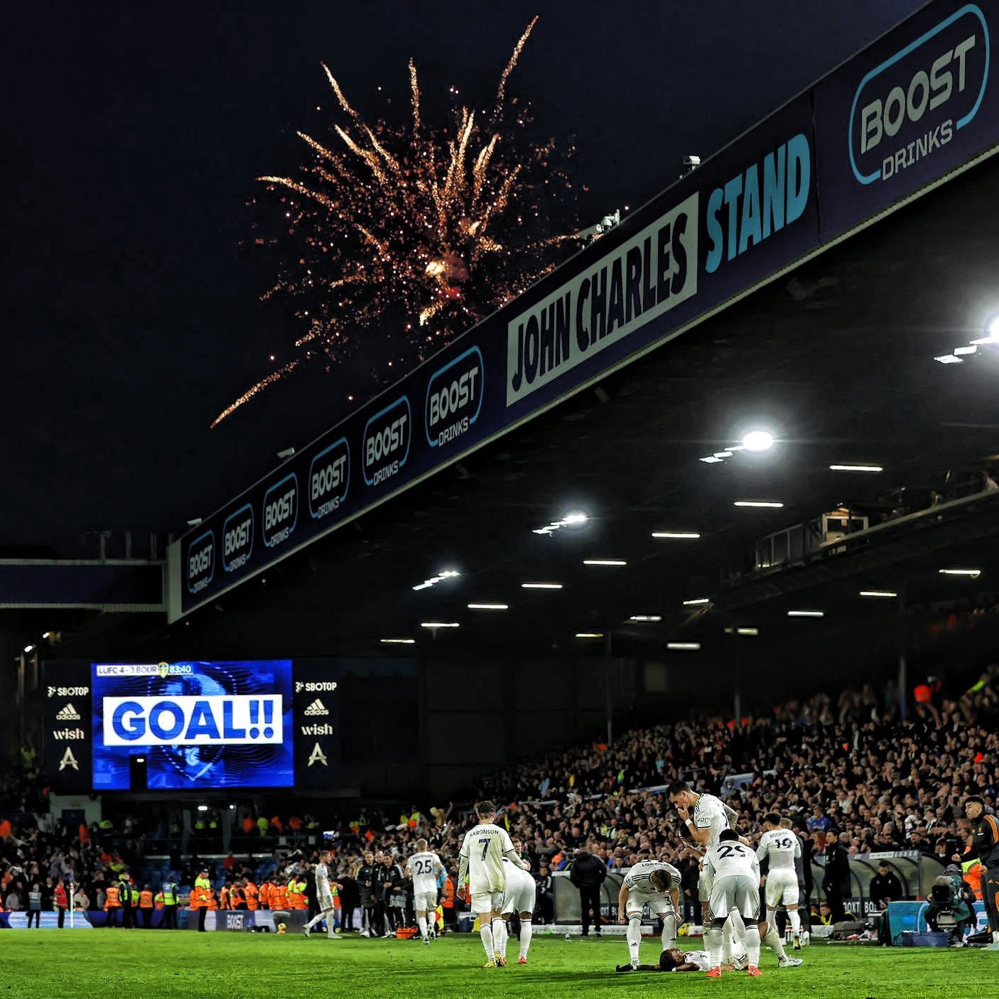 Leeds United fans and players celebrating a win over Bournemouth