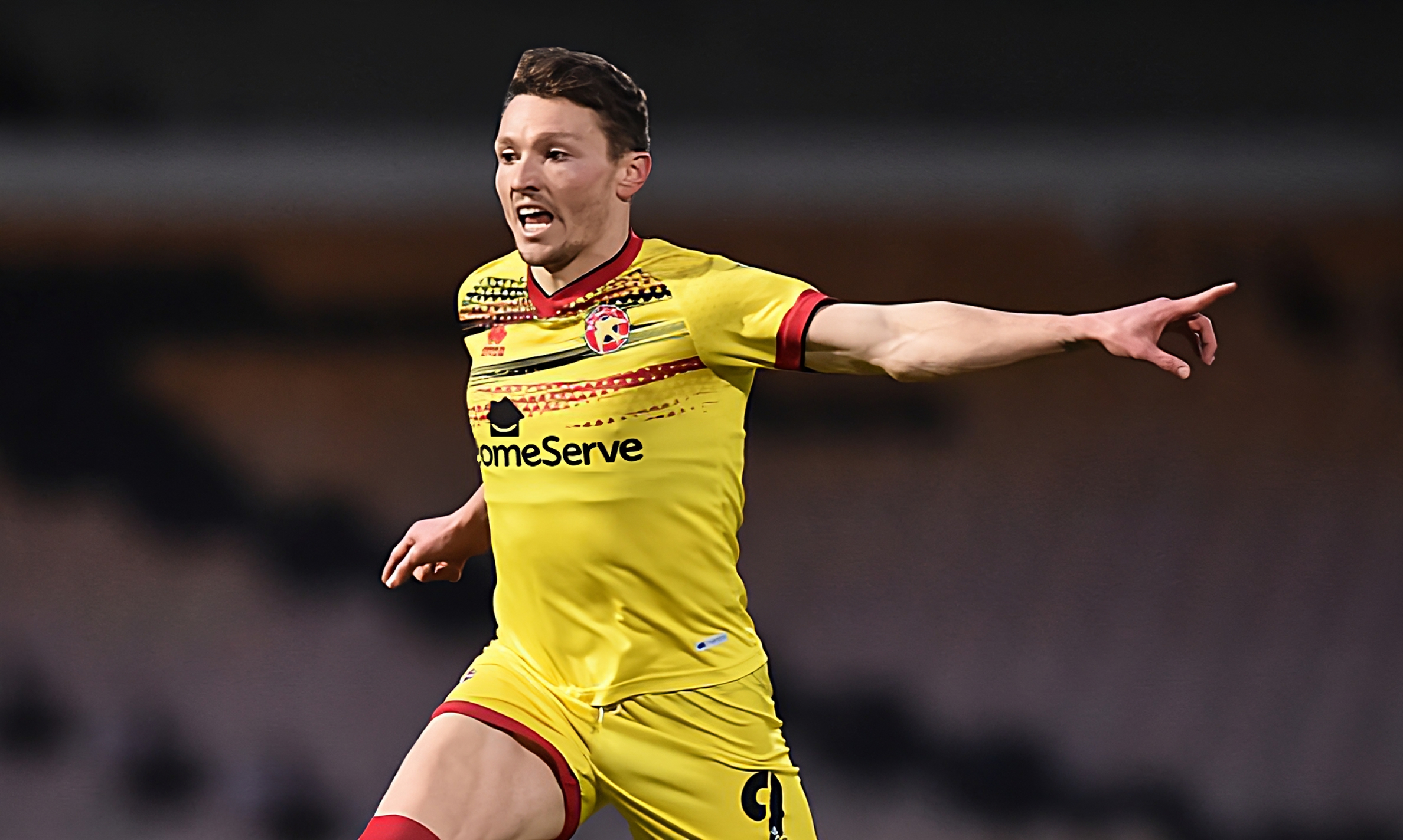 Striker Caolan Lavery runs and points during match