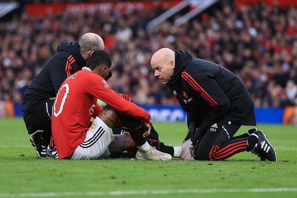 Marcus Rashford, pictured on the floor injured, has travelled with the Manchester United squad to Newcastle