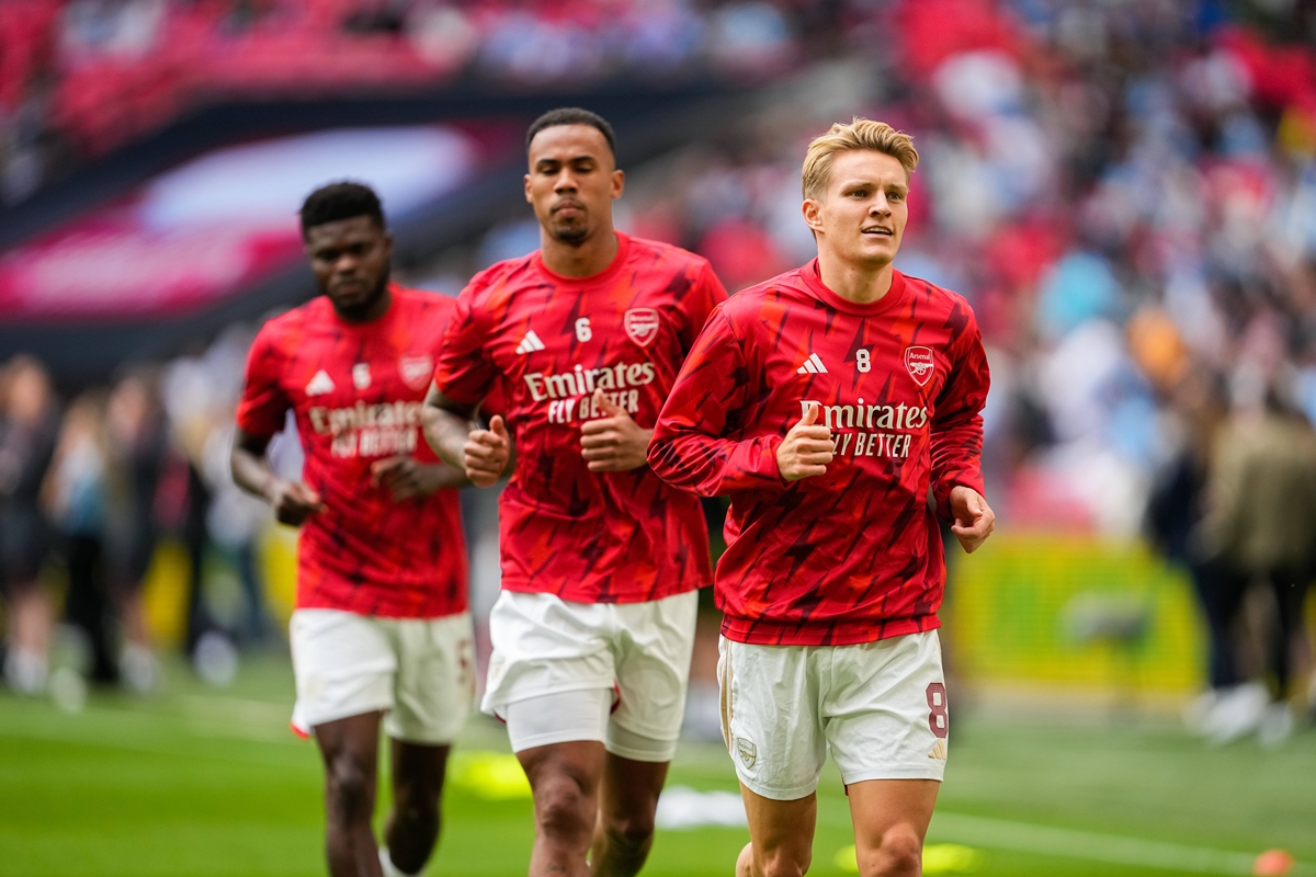 Thomas Partey, Gabriel, and Martin Odegaard warm up before a match