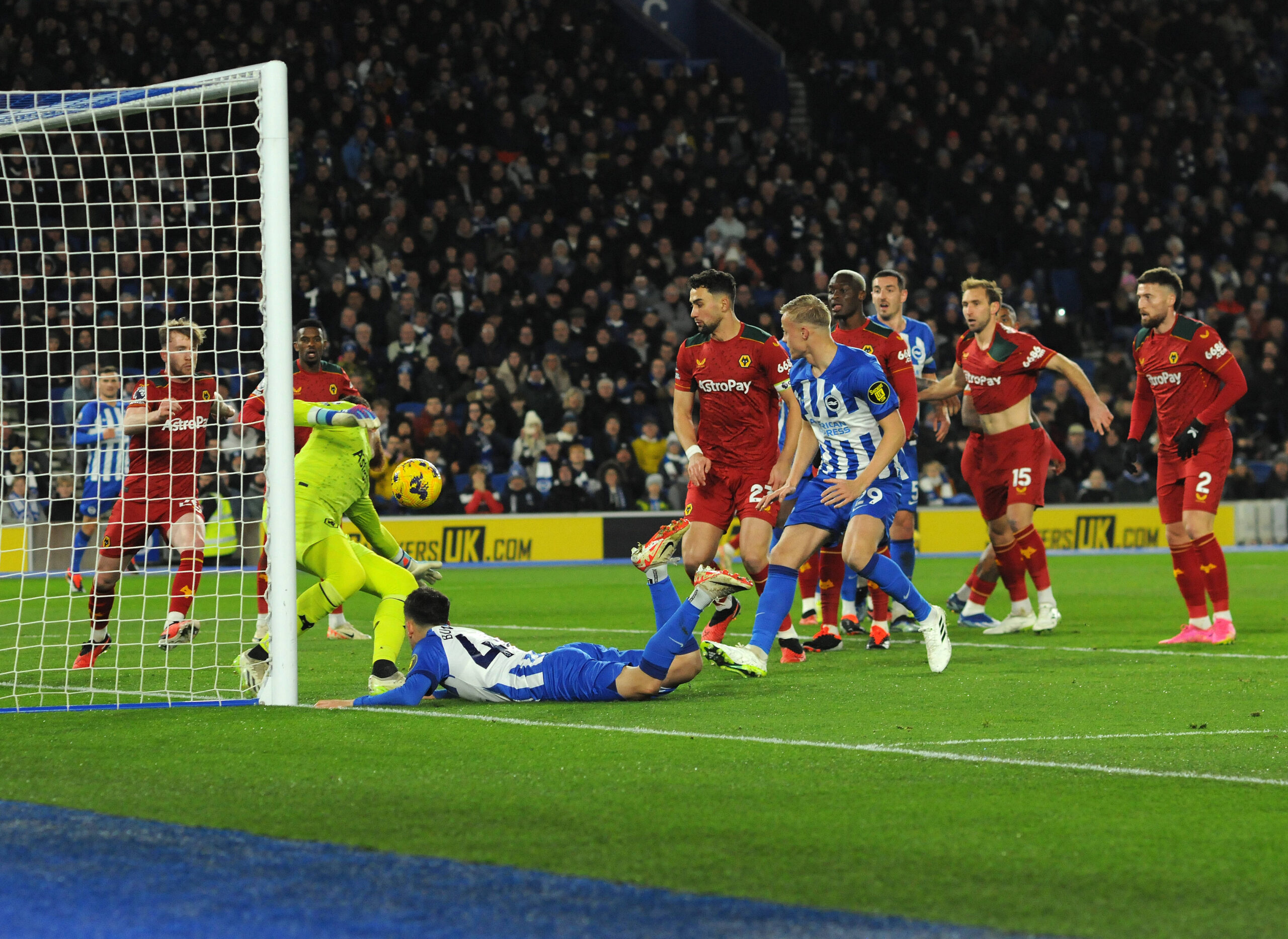 Brighton and Wolves players scramble on the goal line after a header