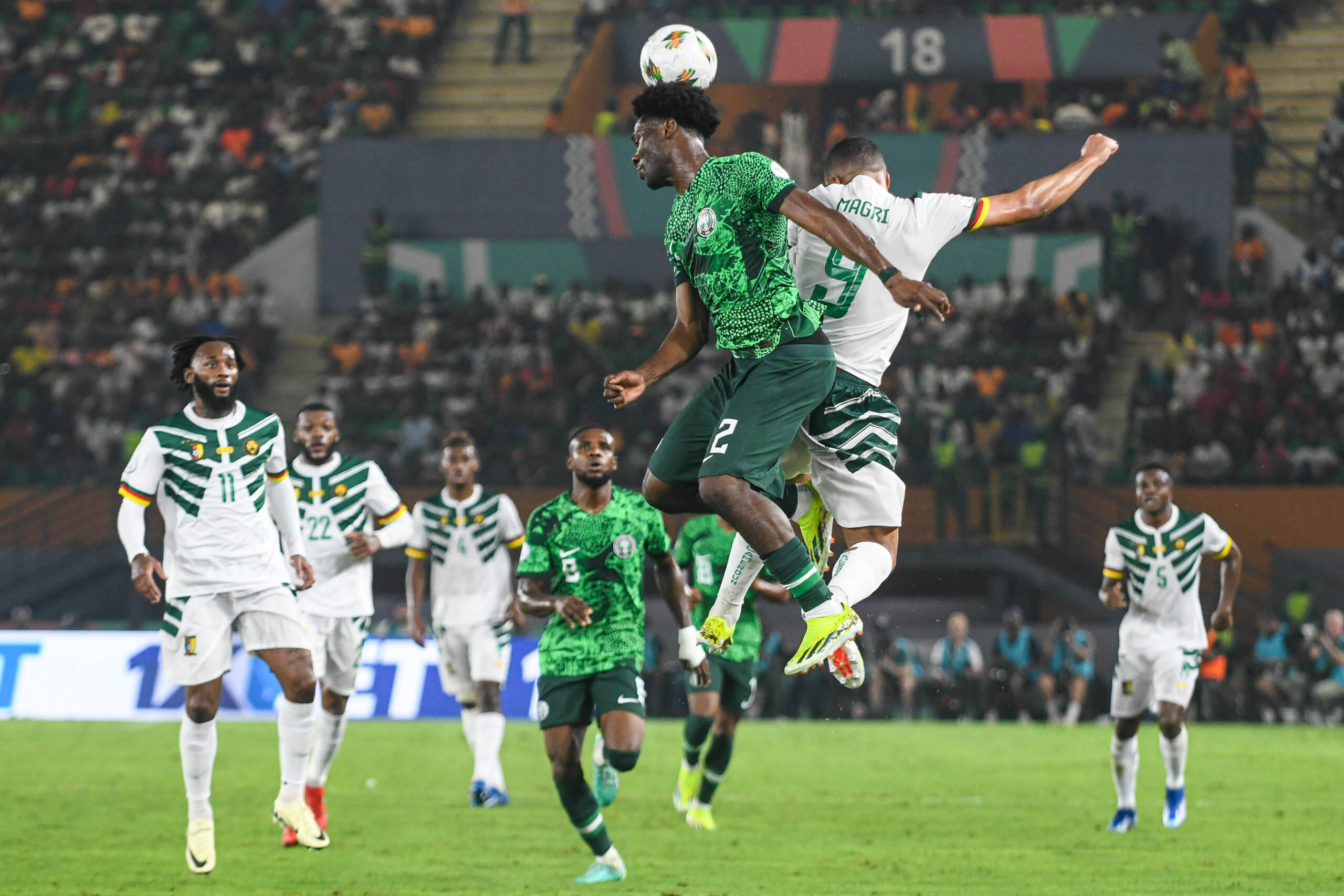 Ola Aina battles for the ball in the air