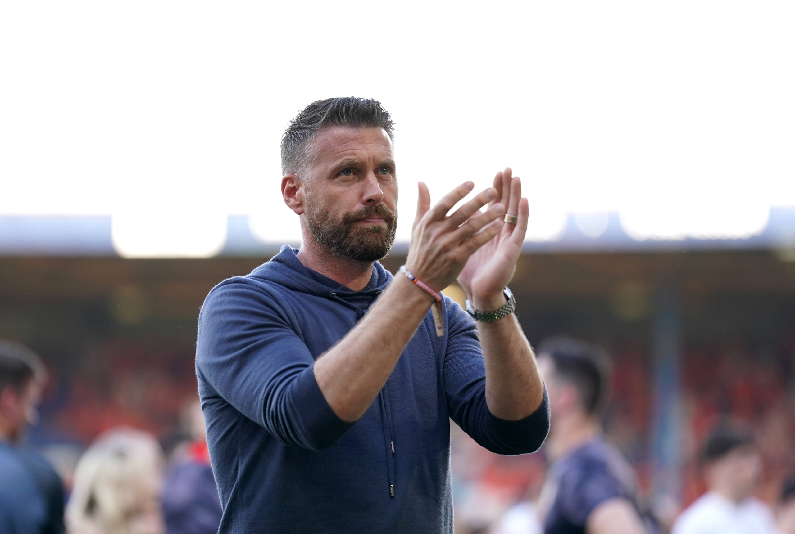 Rob Edwards of Luton applauding fans following final Premier League match