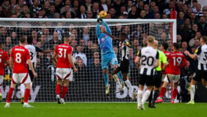 Matz Sels competes for ball against Newcastle United player