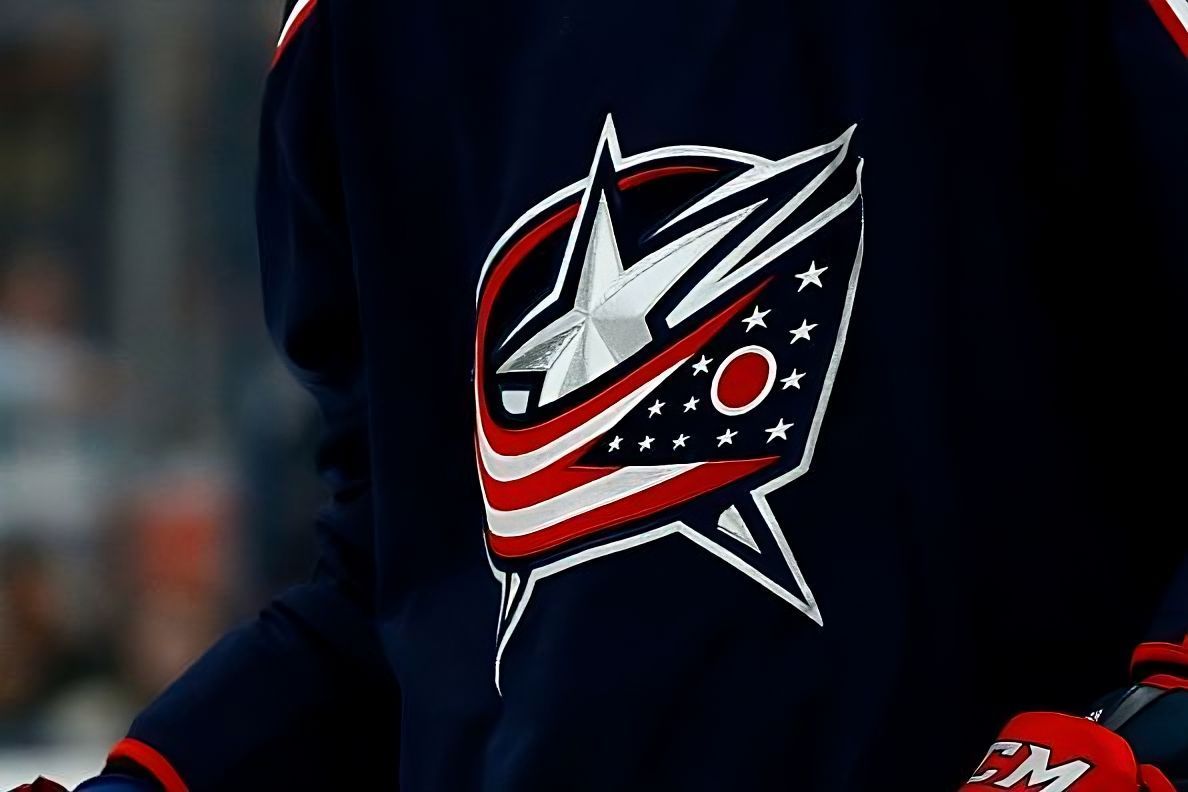 Picture of the Columbus Blue Jackets logo on their dark home jersey.