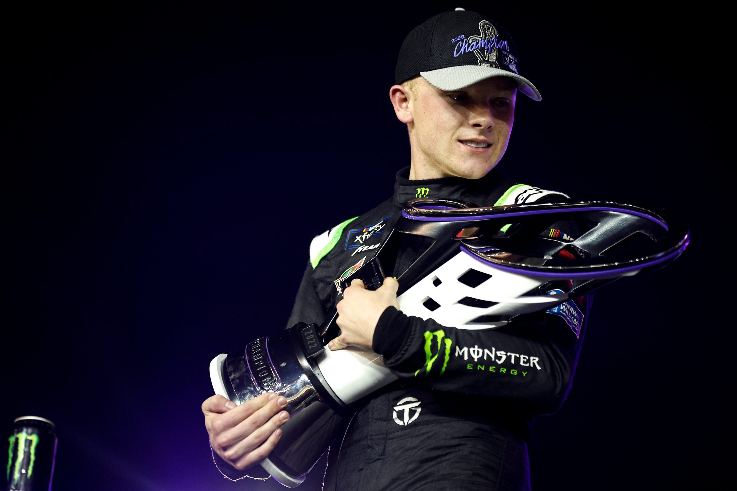 AVONDALE, ARIZONA - NOVEMBER 05: Ty Gibbs, driver of the #54 Monster Energy Toyota, embraces the 2022 NASCAR Xfinity Series Championship trophy in victory lane after winning the NASCAR Xfinity Series Championship at Phoenix Raceway on November 05, 2022 in Avondale, Arizona. (Photo by Jared C. Tilton/Getty Images)