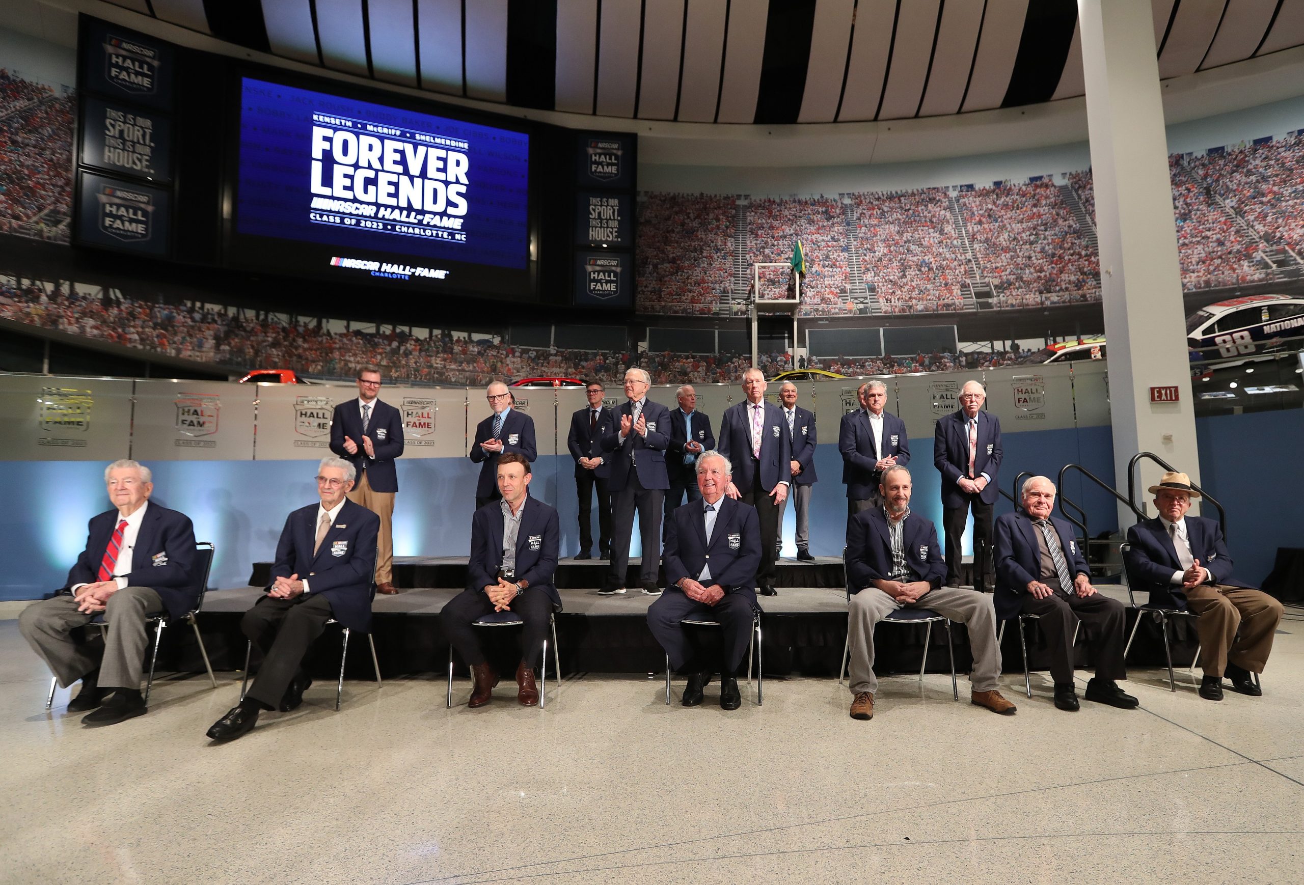 Credit: CHARLOTTE, NORTH CAROLINA - JANUARY 19: (L-R) NASCAR Hall of Famers (front-row) Bobby Allison, Leonard Wood, Matt Kenseth, Hershel McGriff, Kirk Shelmerdine, Jerry Cook, Jack Roush (back-row) Dale Earnhardt Jr., Mark Martin, Joe Gibbs, Bobby Labonte, Red Farmer, (back-row) Ray Evernham, Dale Jarrett and Ron Hornaday Jr. pose for photos during the Blue Jacket Ceremony at NASCAR Hall of Fame on January 19, 2023 in Charlotte, North Carolina. (Photo by David Jensen/Getty Images)