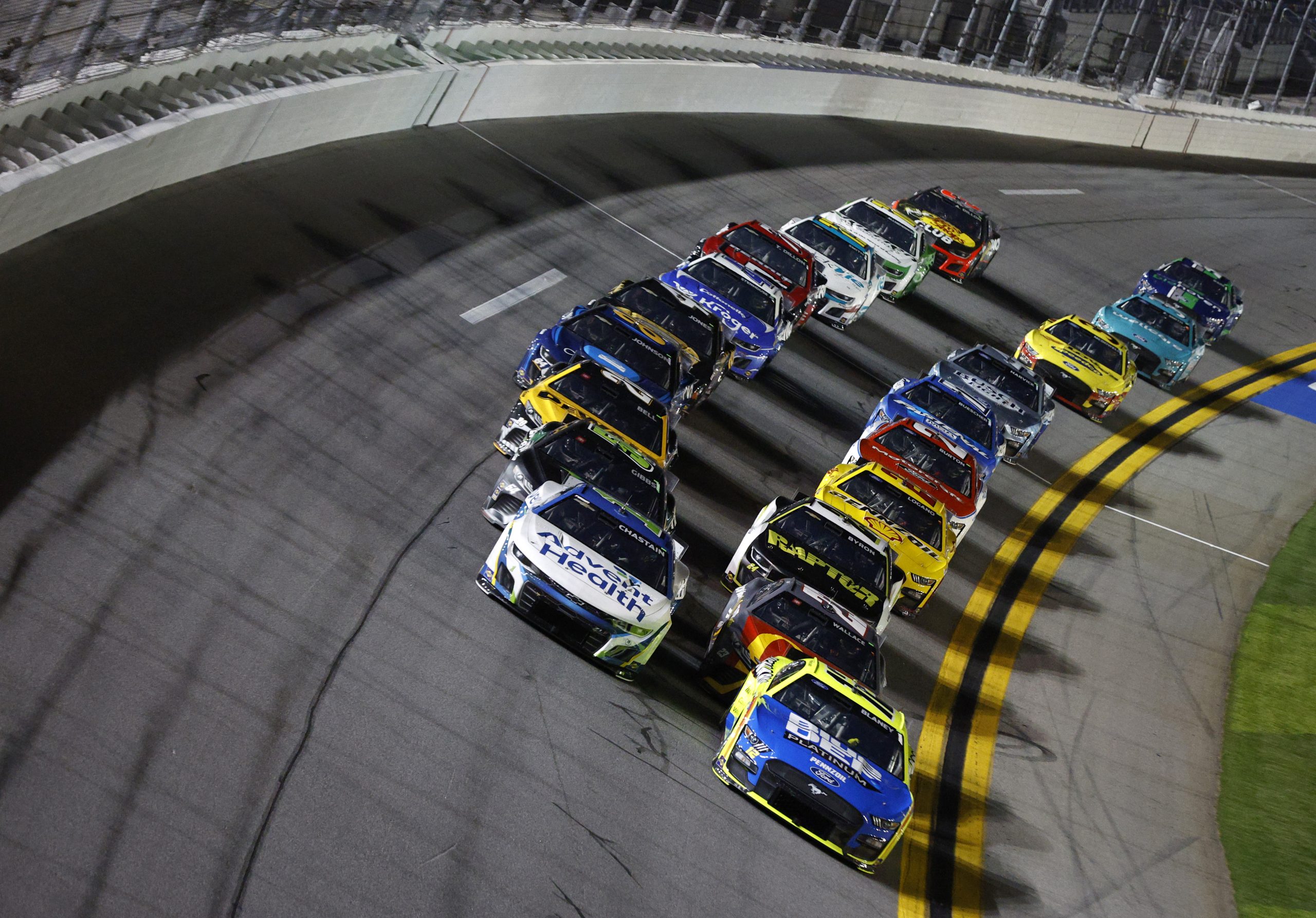 DAYTONA BEACH, FLORIDA - FEBRUARY 16: Ryan Blaney, driver of the #12 Menards/Blue DEF/PEAK Ford, and Ross Chastain, driver of the #1 AdventHealth Chevrolet, lead the field during the NASCAR Cup Series Bluegreen Vacations Duel #1 at Daytona International Speedway on February 16, 2023 in Daytona Beach, Florida. (Photo by Sean Gardner/Getty Images)