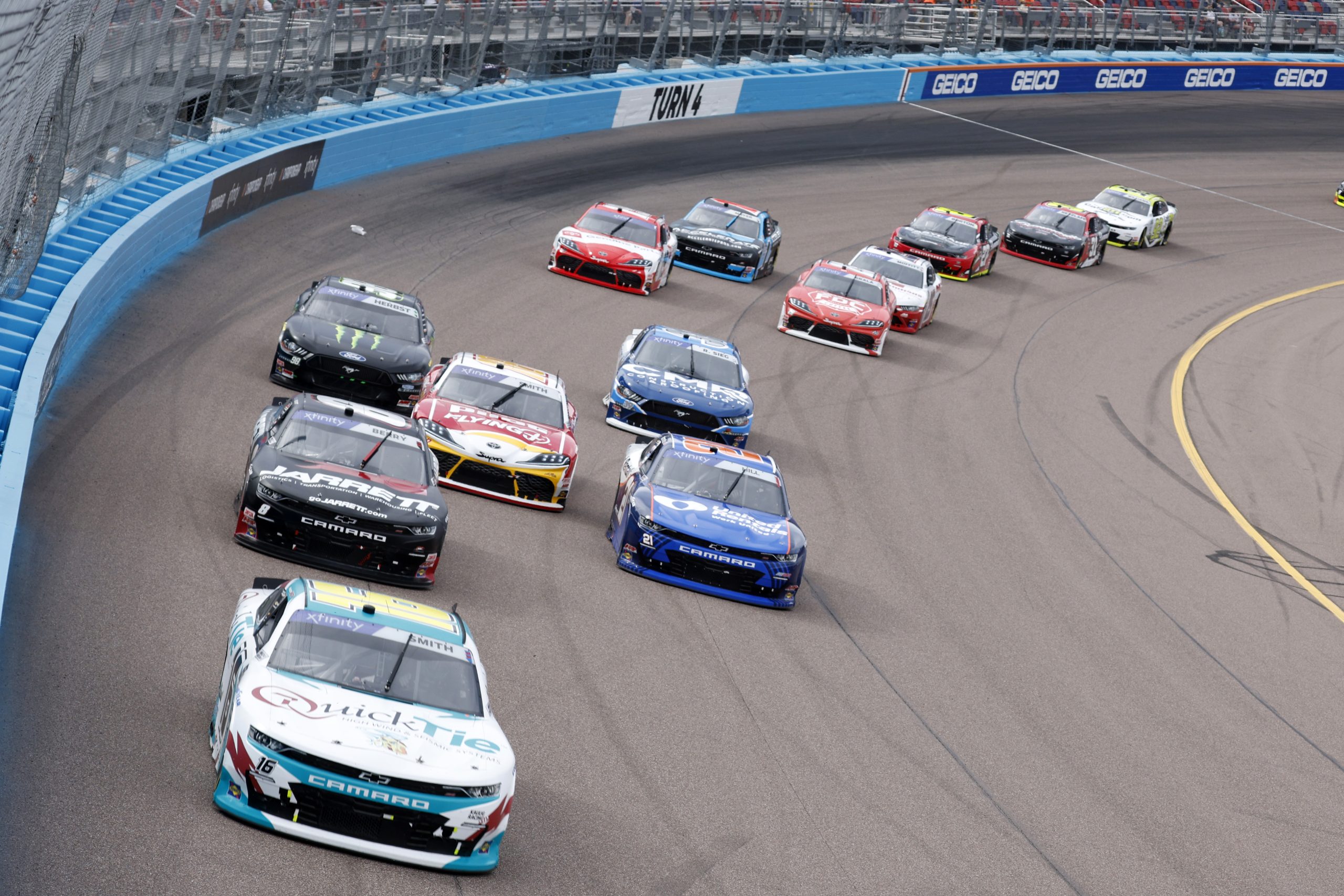 AVONDALE, ARIZONA - MARCH 11: Chandler Smith, driver of the #16 Quick Tie Products Inc. Chevrolet, Josh Berry, driver of the #8 Jarrett Logistics Systems Chevrolet, and Austin Hill, driver of the #21 United Rentals Chevrolet, race during the NASCAR Xfinity Series United Rentals 200 at Phoenix Raceway on March 11, 2023 in Avondale, Arizona. (Photo by Chris Graythen/Getty Images)