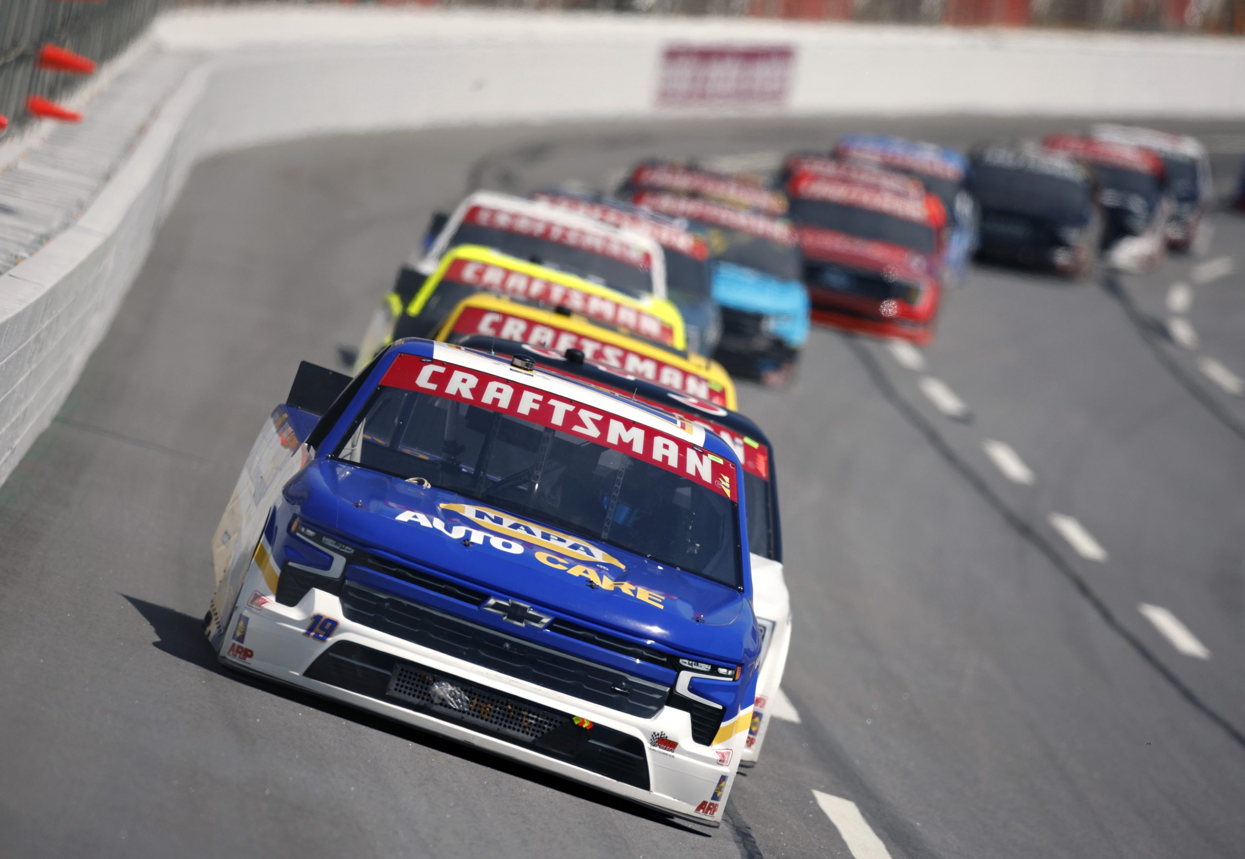 HAMPTON, GEORGIA - MARCH 18: Christian Eckes, driver of the #19 NAPA AutoCare Chevrolet, leads the field during the NASCAR Craftsman Truck Series Fr8 208 at Atlanta Motor Speedway on March 18, 2023 in Hampton, Georgia. (Photo by Sean Gardner/Getty Images)