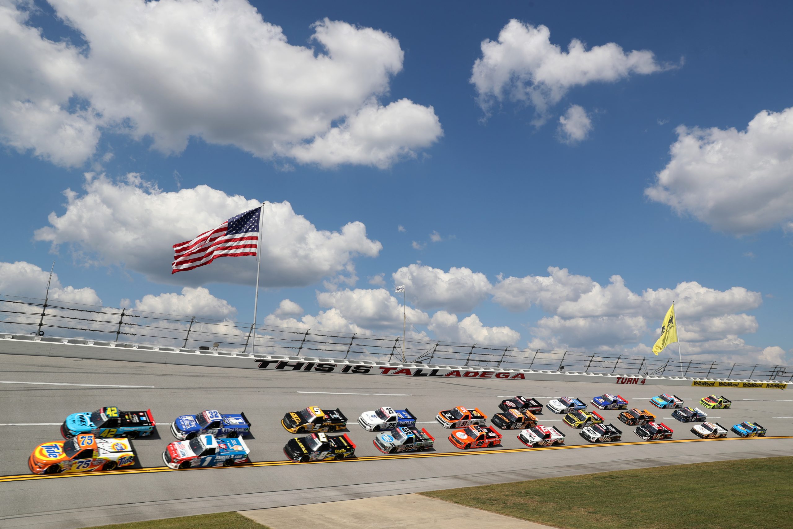 Parker Kligerman, driver of the #75 Tide Chevrolet, and Carson Hocevar, driver of the #42 Worldwide Express Chevrolet, lead the field during the NASCAR Craftsman Truck Series Love's RV Stop 250 at Talladega Superspeedway on September 30, 2023 in Talladega, Alabama.