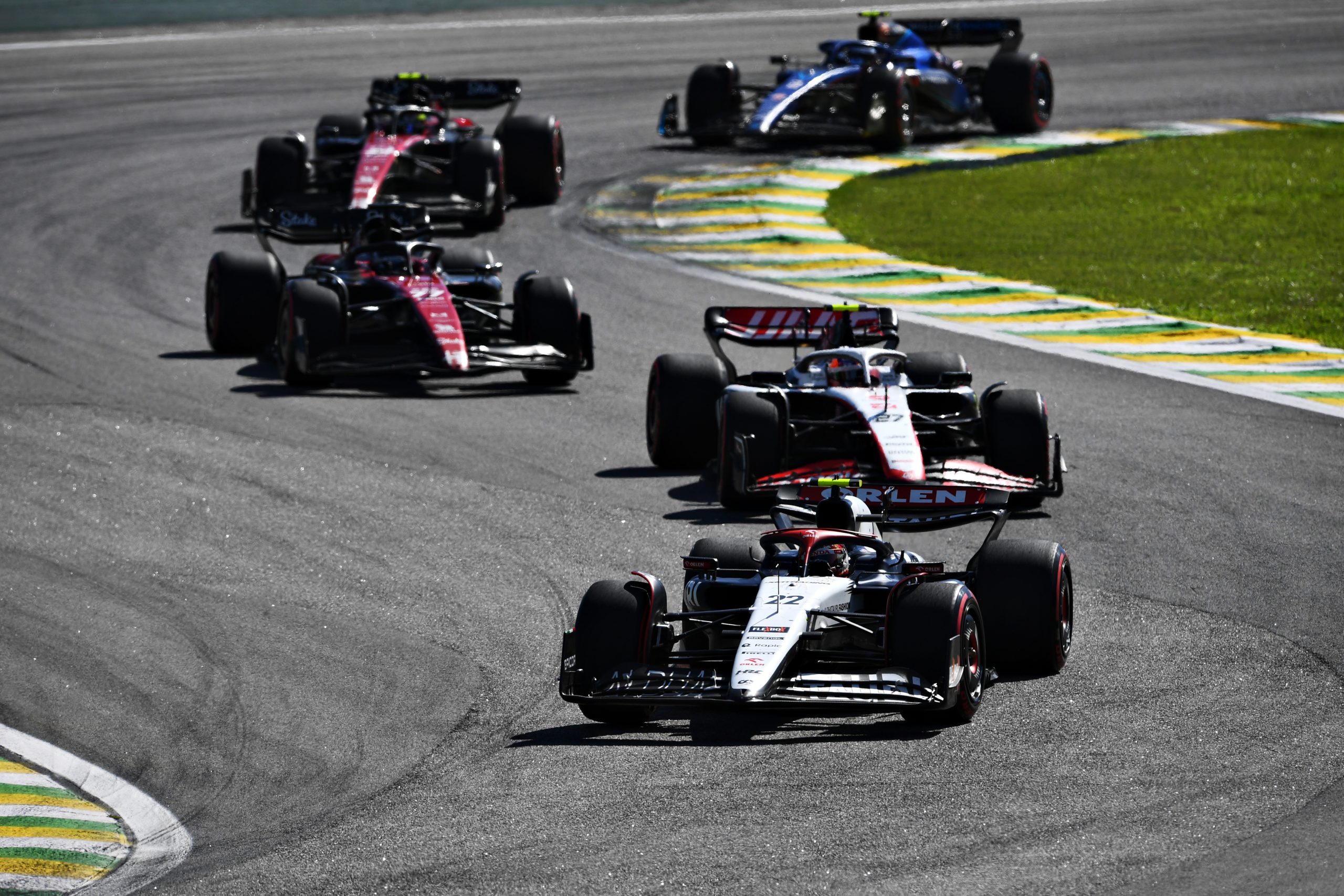 Yuki Tsunoda driving the (22) Scuderia AlphaTauri leads Nico Hulkenberg driving the (27) Haas F1, Valtteri Bottas (77) driving the Alfa Romeo and Zhou Guanyu (24) driving the Alfa Romeo, on track during the F1 Grand Prix of Brazil, 2023