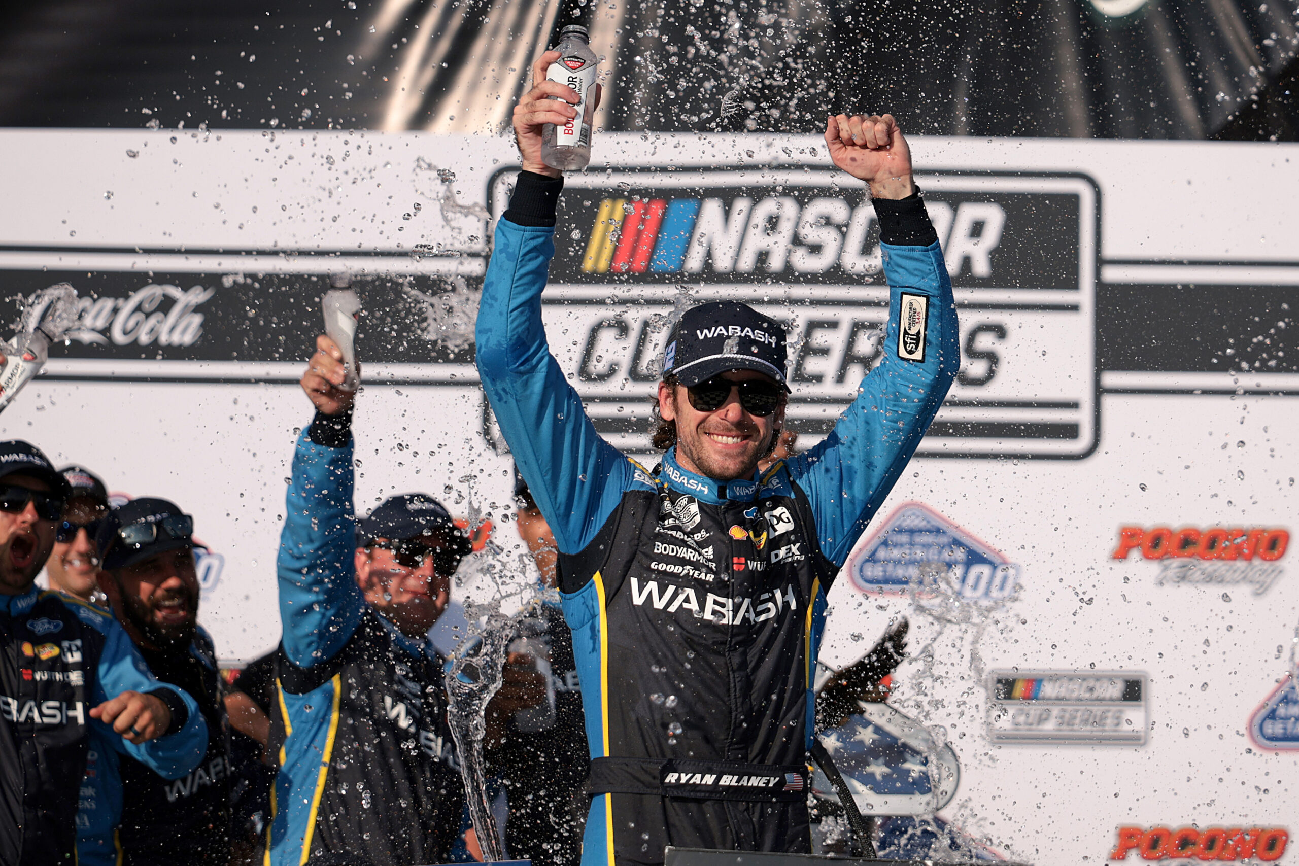 LONG POND, PENNSYLVANIA - JULY 14: Ryan Blaney, driver of the #12 Wabash Ford, celebrates in victory lane after winning the NASCAR Cup Series The Great American Getaway 400 Presented by VISITPA.com at Pocono Raceway on July 14, 2024 in Long Pond, Pennsylvania. (Photo by James Gilbert/Getty Images)