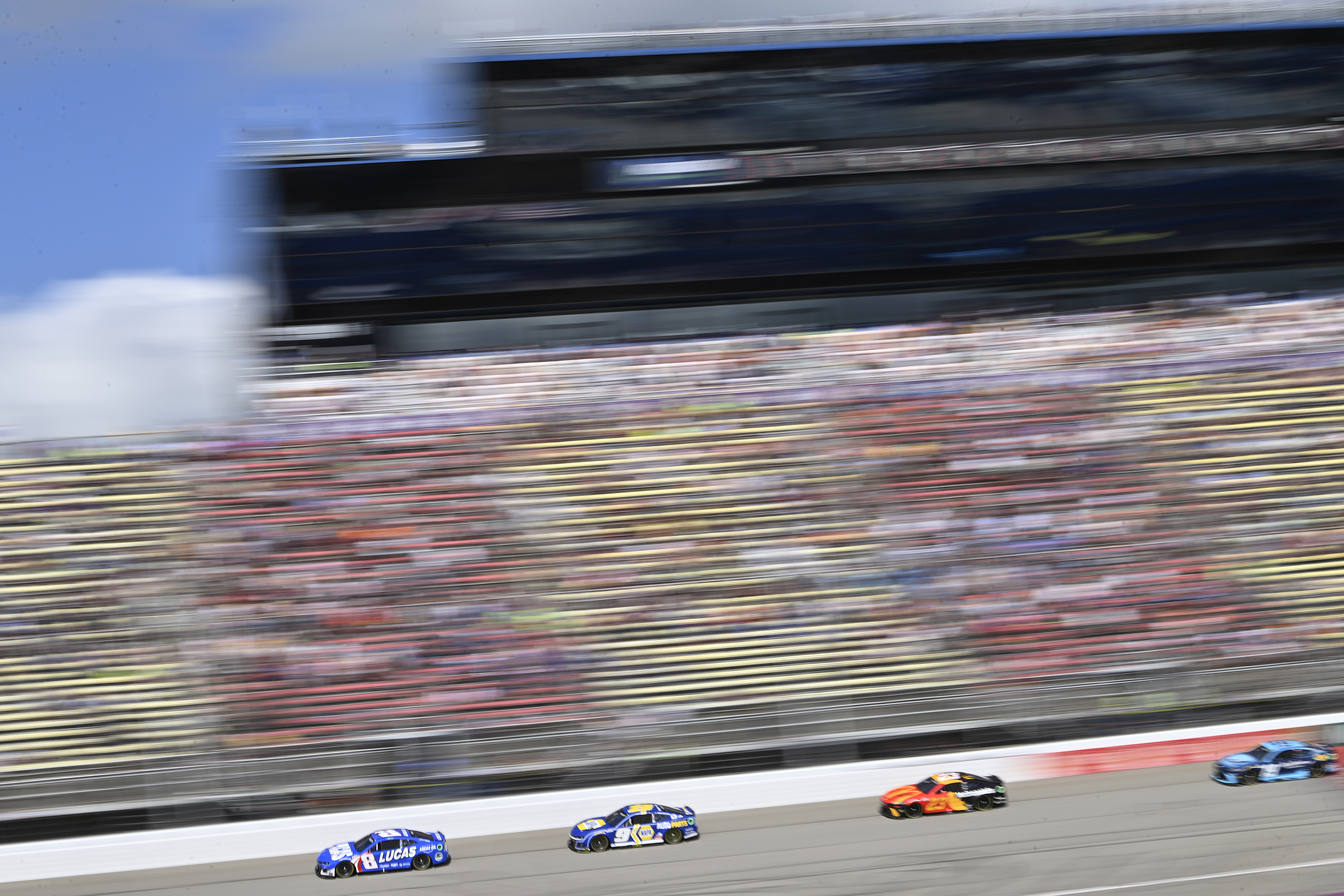 BROOKLYN, MICHIGAN - AUGUST 19: Kyle Busch, driver of the #8 Lucas Oil Chevrolet, Chase Elliott, driver of the #9 NAPA Auto Parts Chevrolet, Bubba Wallace, driver of the #23 McDonald's Toyota, and Martin Truex Jr., driver of the #19 Auto-Owners Insurance Toyota, race during the NASCAR Cup Series FireKeepers Casino 400 at Michigan International Speedway on August 19, 2024 in Brooklyn, Michigan. (Photo by Logan Riely/Getty Images)