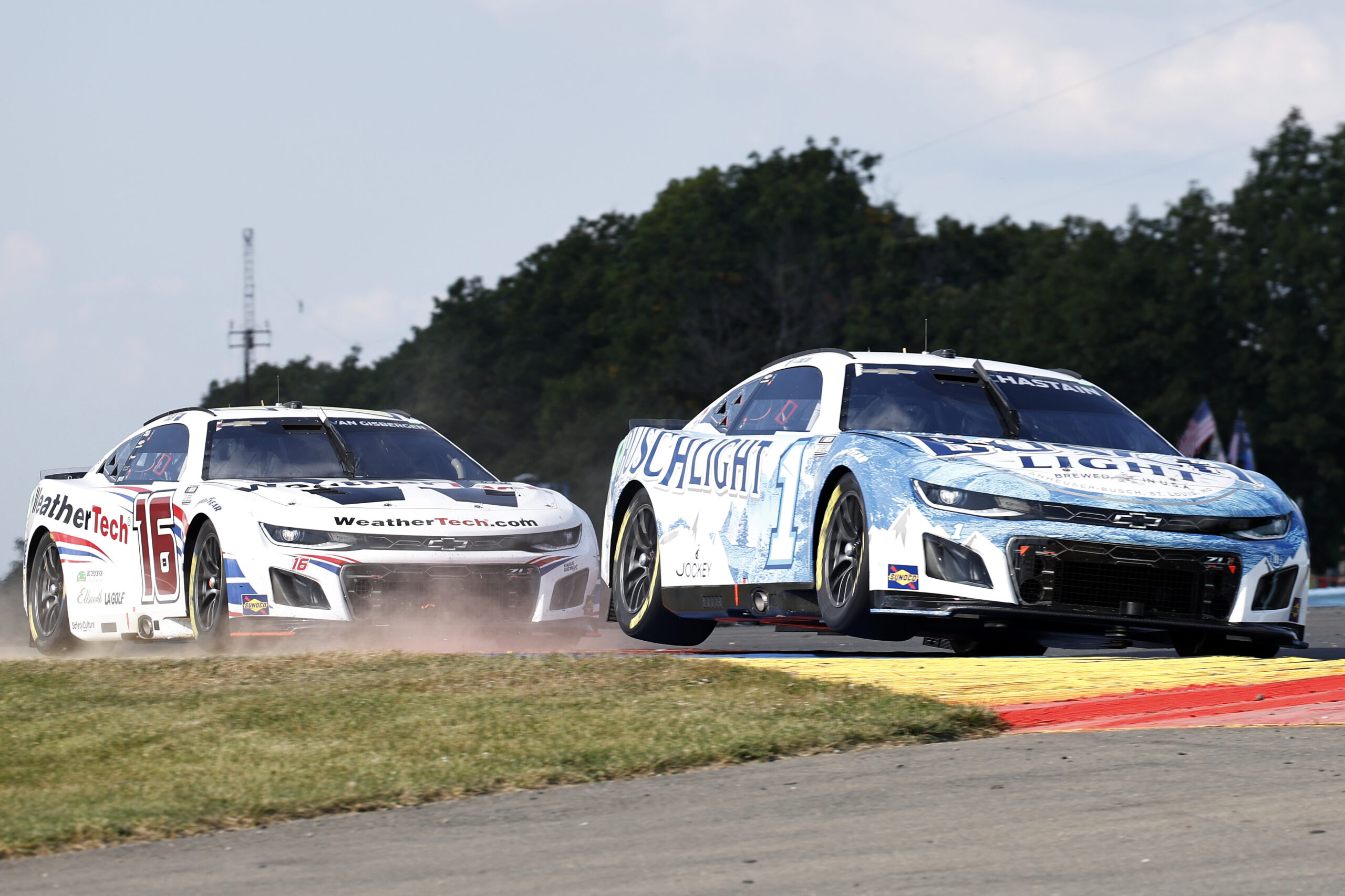 WATKINS GLEN, NEW YORK - SEPTEMBER 15: Ross Chastain, driver of the #1 Busch Light Chevrolet, and Shane Van Gisbergen, driver of the #16 WeatherTech Chevrolet, race during the NASCAR Cup Series Go Bowling at The Glen at Watkins Glen International on September 15, 2024 in Watkins Glen, New York.