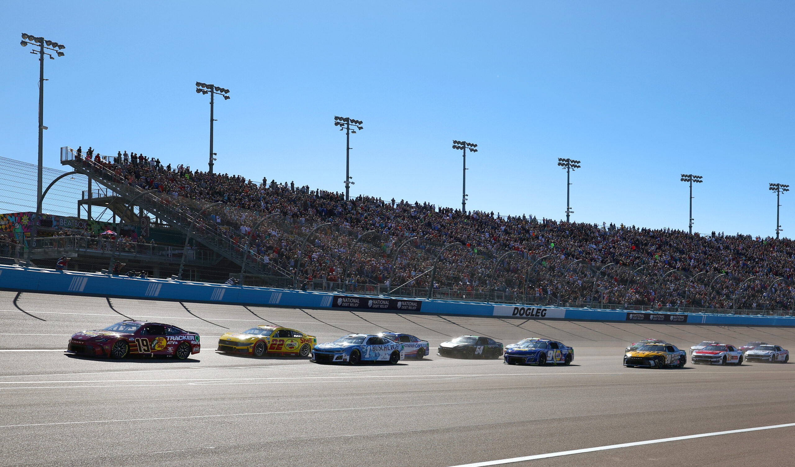 Credit: AVONDALE, ARIZONA - NOVEMBER 10: Martin Truex Jr., driver of the #19 Bass Pro Shops Toyota, leads the field to start the NASCAR Cup Series Championship Race at Phoenix Raceway on November 10, 2024 in Avondale, Arizona. (Photo by Jared C. Tilton/Getty Images)