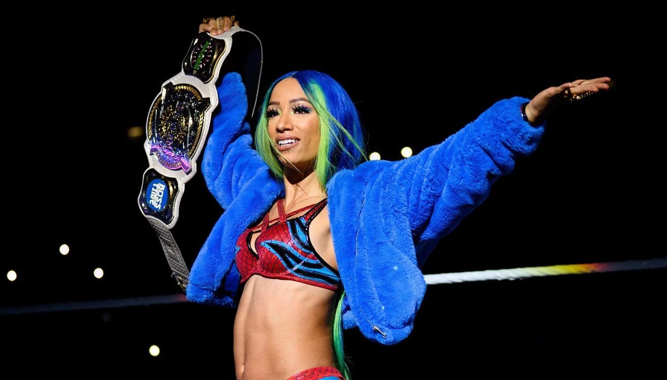 Sasha Banks holding the WWE Women's Tag Team Championship.