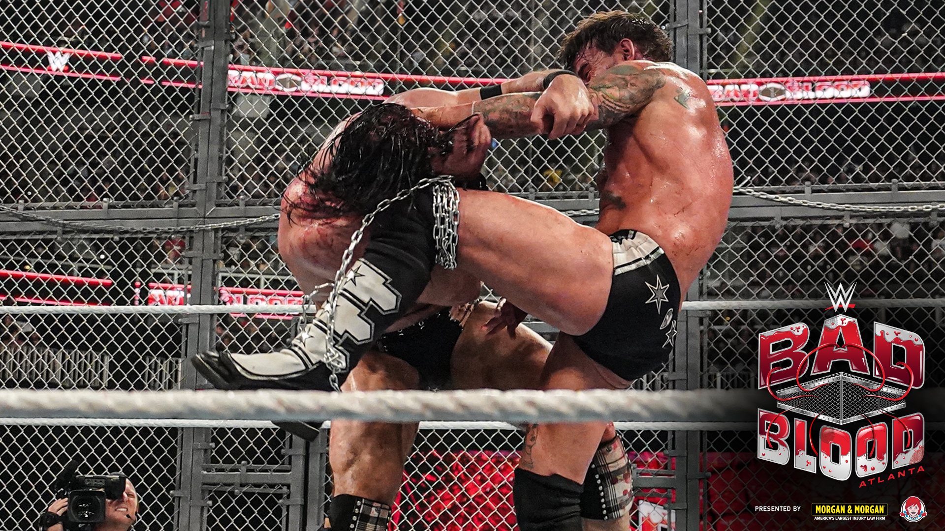 A photo of CM Punk and Drew McIntyre during their "Hell in a Cell" Match at WWE Bad Blood.