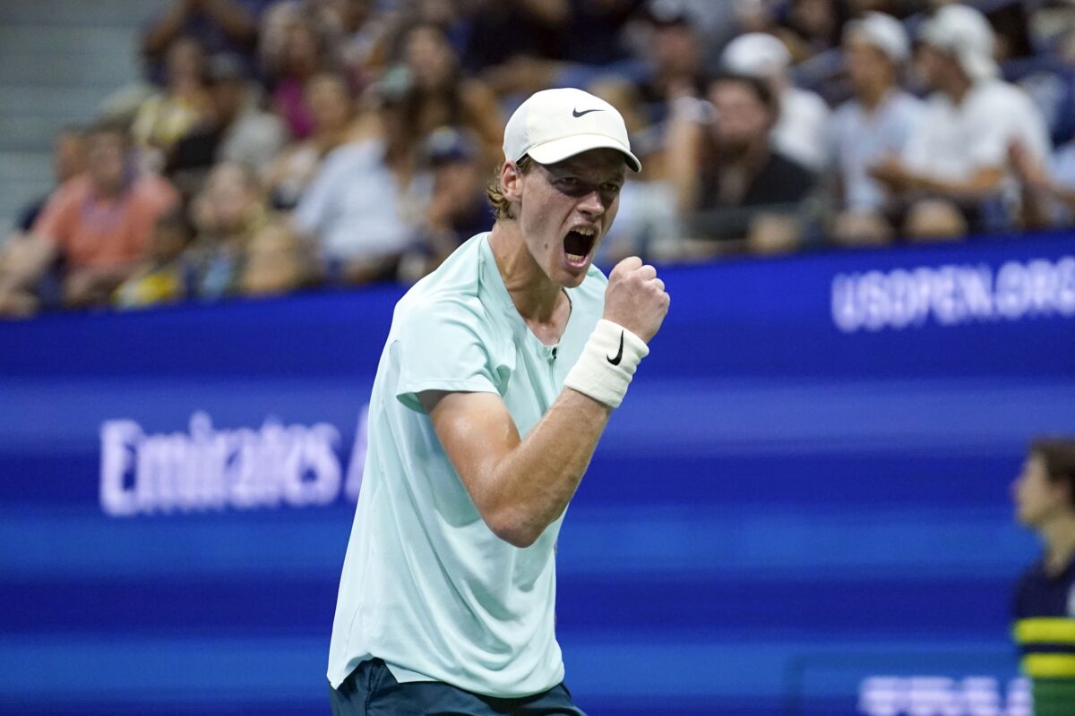 Jannik Sinner celebrates winning a point.